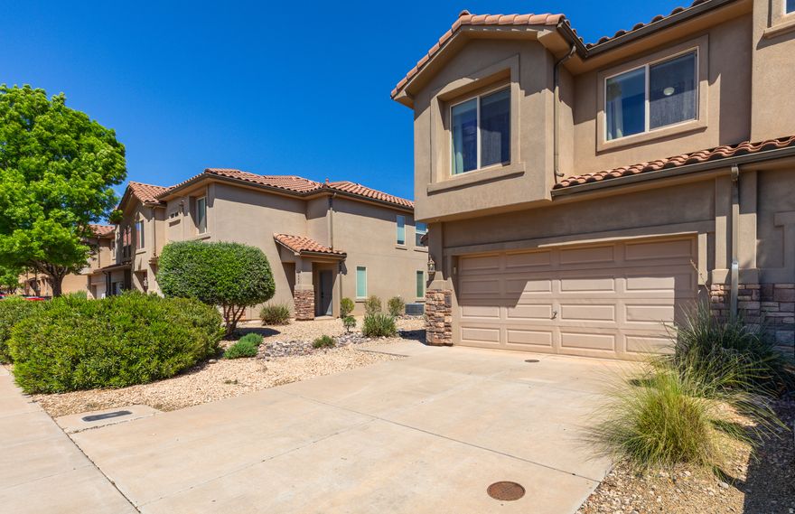 Maintenance free, turn-key townhome within walking distance to parks, trails, schools, grocery, and restaurants. This 3 bed/2.5 bath end-unit comes fully furnished including a fully equipped kitchen and private patio. The home has been meticulously cared for as a second home by its original owners. This was the model unit for Tuscany at Cliffrose, displaying the highest quality and most functional layout. It is move-in ready in every way: appliances, bedding, utensils, garage tools...and a huge walk in closet - perfect for primary owners, second homes, or investors. Enjoy Proximity to Tuacahn, Snow Canyon, Black Desert Resort, Gunlock Reservoir, and a 30 minute drive to the expanding St George Regional Airport.