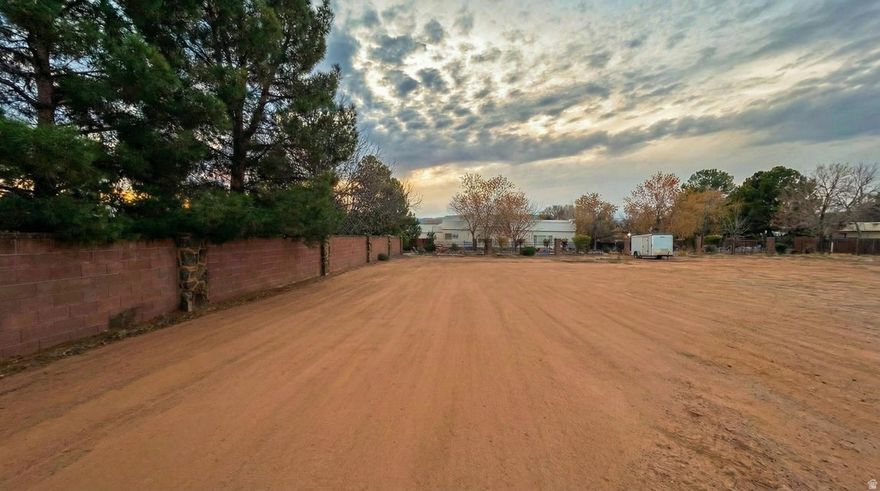 Prime 0.72-Acre Estate Lot in Desirable Bloomington - Build Ready!  Seize the opportunity to own a massive 0.72-acre (31,363 sq ft) buildable lot in the heart of St. George's sought-after Bloomington neighborhood. This flat, development-ready parcel is located in an established golf course community known for its mature landscaping and active lifestyle. Enjoy the convenience of parks, paved trails, and Bloomington Elementary School right within the neighborhood.  Utilities are available at the street. To jumpstart your build, architectural plans available, and contractor for consultation/ construction