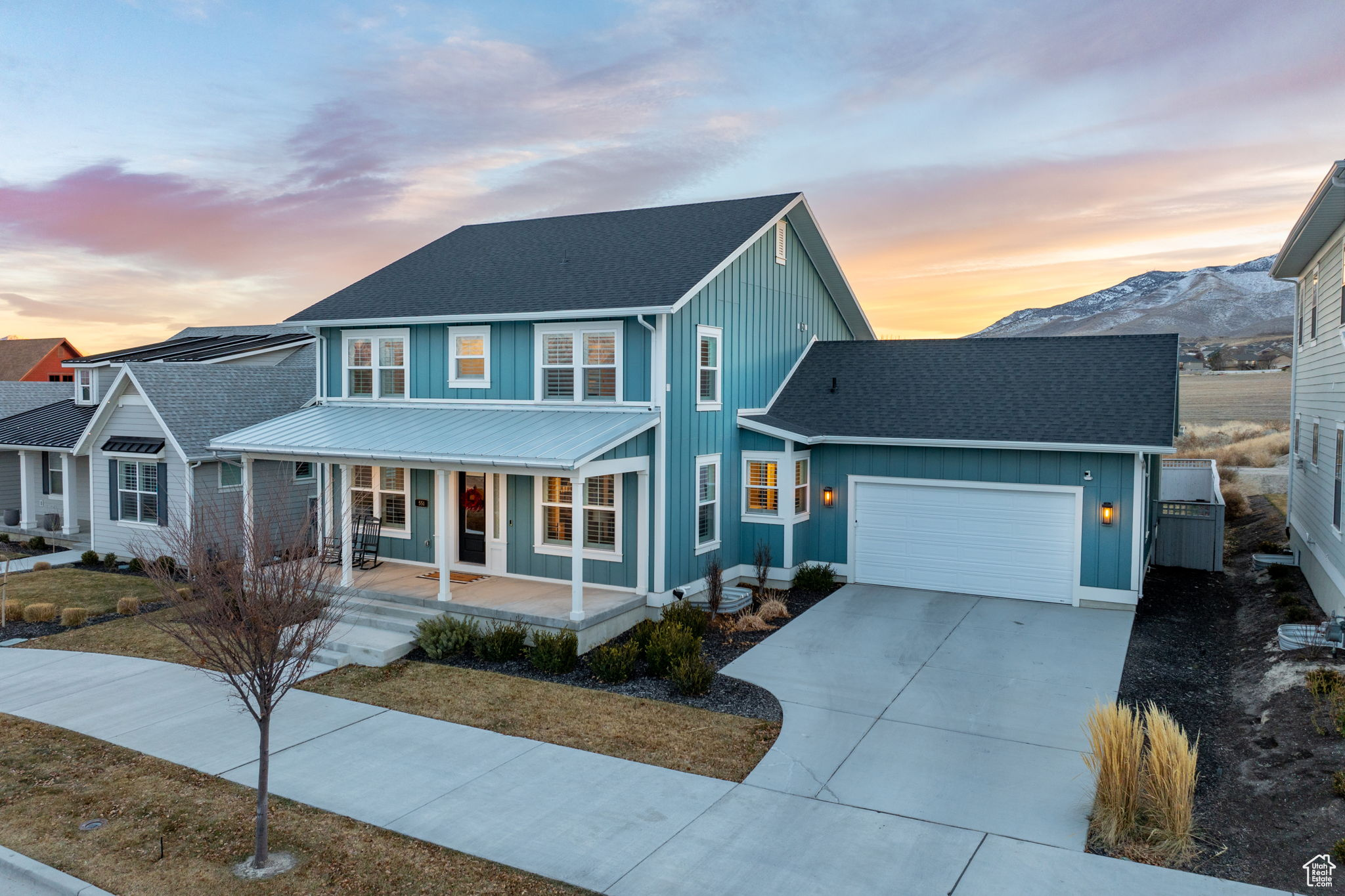 Get all the conveniences of new construction without the wait or added expense with this stunning home in Beacon Pointe. Built in 2022 on a large, flat lot boasting views of Mount Timpanogos and the newly built Saratoga Springs Temple. A modern farmhouse spanning 4,289 sqft, with a coastal style front porch, the perfect place to take in the stunning views and quiet sense of community offered here. Step inside to warm/inviting finishes, 9 ft ceilings, and an open concept living area with gas fireplace. The main floor floods with natural light through a wall of south facing windows, opening directly to the fully fenced and landscaped backyard, sparing you the expense of landscaping that would come with new construction. The kitchen is a chef's dream, with a gas range, custom vent hood, dual ovens, oversized walk in pantry, ceiling-height white oak cabinets with slow-close functionality, and a large island with plenty of prep space, additional cabinet storage, and seating for 3. Featuring high end finishes throughout including quartz countertops, upgraded carpet and pad, white oak laminate flooring, custom tile work, and in the bedrooms you'll find ample closet space, natural light, and breathtaking views. The primary suite is a true retreat with large east and south facing windows, 2 separate vanities, a beautiful free standing  tub, and oversized euro shower. The home is equipped for convenience and luxury, with a smart home security system, finished basement with cold storage, mudroom with lockers, and a 4-car tandem garage that includes a 240v EV outlet. Additional features include a dedicated, main floor office retreat, and formal living room, pre-wiring for fiber internet throughout, and custom shutter style window treatments. Beacon Pointe is a beautifully maintained master planned community offering  extra-wide sidewalks, that invite leisurely strolls, lush green spaces and many more amenities to come including a pool and community park. From its striking curb appeal to its meticulously crafted interior, this home is a true masterpiece. Don't miss the opportunity to own this exceptional property.  Square footage figures are provided as a courtesy estimate only and were obtained from builder plans.  Buyer is advised to obtain an independent measurement.