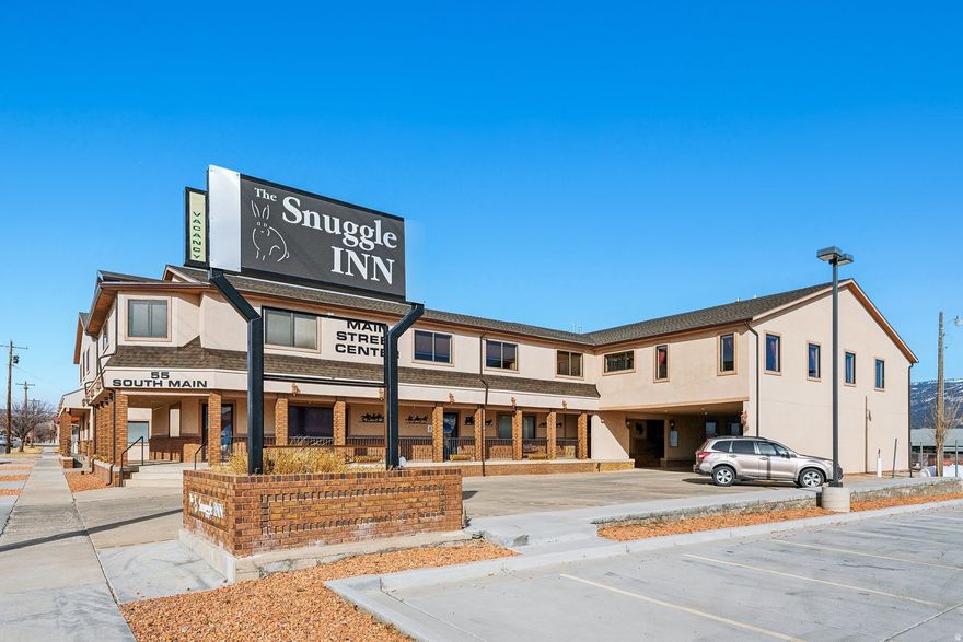 Seller Financing Available *updated 11/10* Please inquire for terms - HUGE PRICE IMPROVEMENT! Fantastic opportunity with multiple options for upside! Step into your own Utah retreat, haven, and Nat'l park sanctuary! Welcome to Loa (pop. 600) & The Snuggle Inn, family owned for 30+ years with world-wide visitors & 5-star reviews on Airbnb & Google . This 22,000 sq ft profitable hotel & commercial property currently operating as 17 rooms & suites with 3 commercial spaces on Main Street frontage, a commercial restaurant kitchen with dining room & additional space for suite/commercial opportunity. Property includes 3,500 sq ft 2 bd 2 ba owner's condo for on-site manager or additional guest suites & 1,200 sq ft shop for vehicle, storage and toys. Zoned residential & commercial giving more financing options for Owner users and savvy investors! The property is being sold fully furnished and decorated to maintain seamless transfer of ownership (some personal property excluded). Convenient to Utah's Mighty 5 National Park, 21 miles to Capital Reef & 13 mi to Fishlake & Pando. Loa has County offices, grocery/hardware/farm-feed stores, USPS, Family Dollar, bank, cafe, & 2 gas stations/auto repair, all within walking distance. Keep as Inn, Airbnb, or make a vacation home /condos /apts/ BnB or retreat lodge. Embrace tranquility in this outdoor lover's sanctuary & immerse yourself in nature breathing in fresh mountain air, while viewing the stars in the dark night skies. Schedule your private tour today!