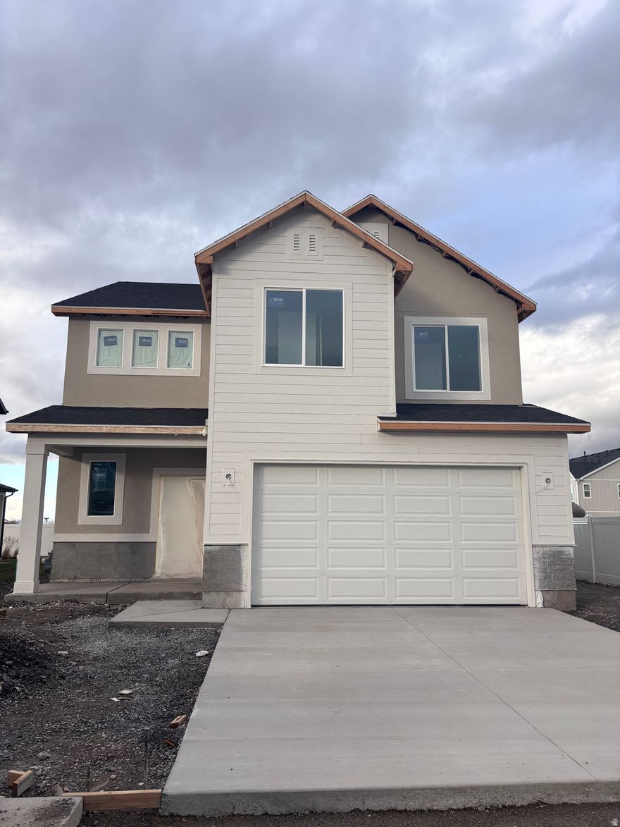 Meet the Eucalyptus, a beautifully designed two-story home featuring 9-foot ceilings, an electric fireplace, and upgraded finishes throughout. The kitchen offers a large island and walk-in pantry, while the upstairs includes a small but versatile loft, spacious primary suite with walk-in shower and closet, and two additional bedrooms each with their own walk-in closets! Situated on an amazing lot with only one neighbor, this home is bordered by community open space and located next to the model home. Front and backyard landscaping are included for a truly move-in-ready experience.  Scheduled to be complete by the first of February, this home won't last long!