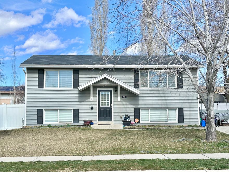 Centrally located Layton home for SALE!  Enjoy an open family room, a wonderful kitchen with gorgeous counter tops and backsplash, a long island with pendant lighting above it, white cabinets, stainless steel appliances that stay with this home, and plenty of space for a breakfast bar and dining.  Basement bathroom fully remodeled in 2023.  Fresh paint on ceilings, main living areas and kitchen.  New AC and furnace in 2021.  Washer and dryer can stay.  This backyard is spacious, fully fenced in 2021 mainly with white vinyl and a nice gate at driveway.  The pergola, fire pit, and raised garden boxes are ready to be used.  This deck was built in 2022 - so nice to enjoy outdoor rest & relaxation time with mountain views.  The shed is fully functional and ready for lots of storage.  Plenty of parking and a long RV pad offers more options.  Metal carport setup can stay.  Schedule your tour today!