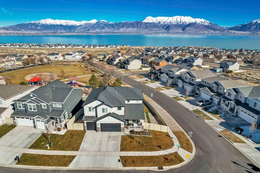 *** OPEN HOUSE THIS SATURDAY MARCH 28th  11- 1 ***  BETTER THAN NEW!!!  Fully Finished 6 Bedroom Home Backing to Park + Mountain and Lake Views!    Welcome to this better-than-new-6 bedroom, 4-bath home perfectly situated on a premium corner lot backing directly to the park with stunning, unobstructed views  of Mount Timpanogos and Utah Lake.   Why wait on new construction when this home is already complete with a fully finished basement, professionally finished and fully fenced yard, and all the upgrades already in place?   The open concept main level features a bright modern kitchen with large walk-in pantry, spacious living areas, and large windows that capture natural light and incredible views.  Upstairs offers 4 generous bedrooms, including a luxurious primary suite, while the fully finished basement provides additional living space perfect for entertaining, guests, or multi-generational living. This home has unbeatable storage; 4 linen closets upstairs, 2 large storage rooms in the basement, and a 3 car garage with hanging shelves.  Step outside to enjoy direct park access, added privacy with no rear neighbors, and a fully fenced backyard ready for immediate use- no extra cost, no waiting.  Located in a desirable community, this home combines space, location, and value in a way thats hard to find.  Please wear provided shoe covers.  Square footage figures are provided as a courtesy estimate only and were obtained from tax data records.  Buyer is advised to obtain an independent measurement.