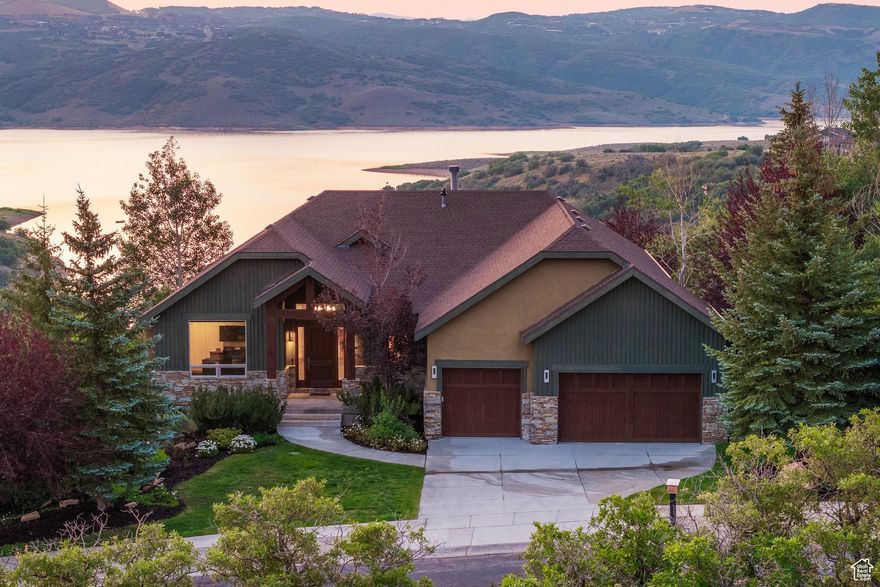 Endless Views. Every Season. One Remarkable Home.  This stunning residence has been thoughtfully designed to exceed expectations.  Beautifully appointed, it offers five spacious ensuite bedrooms, and an ideal layout for both everyday living and entertaining. Set against the backdrop of Deer Valley Resort and the Jordanelle Reservoir, this is where mountain meets the water.  The open floor plan is perfect for hosting family and guests, with generous gathering spaces including an expansive great room that seamlessly connects to a gourmet kitchen, informal and formal dining areas, large outdoor covered patio and a private office. The main level, private primary suite features panoramic views of the Jordanelle, a spa-like bath with a jacuzzi tub and separate shower, and a spacious walk-in closet. Vaulted ceilings, multiple fireplaces, and walls of windows invite natural light and showcase the surrounding beauty in every season. On the lower level, 3 ensuite guest rooms, a large game room with wet bar that opens directly to the backyard and patio creating an ideal space for relaxing or entertaining. With the square footage and flexibility of the floor plan, there is room to be creative for a home gym, second office, or creative space.  An oversized 3-car garage provides ample space for gear and vehicles-making year-round mountain adventures effortless.  Located just minutes from the new East Village at Deer Valley and the Mayflower lift area, and with close proximity to the Jordanelle Reservoir, this home is your perfect base for skiing, hiking, boating, and everything in between. Whether you're here for the winter wonderland or the long summer days, this exceptional home is ready to host a lifetime of memories.