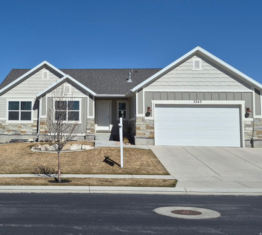 This spacious, like-new rambler is the perfect home for a growing family, a single pacesetter or any size group in between. The beautiful main floor features a large open-concept kitchen, dining and family room space, with a vaulted ceiling and large windows for plenty of natural light. The roomy main suite includes a large walk-in closet and a private bathroom with separate shower and soaking tub. The full basement has a large finished family room, with space for storage and additional living areas, as needed. Ideally located at the top of a peaceful loop, this attractive south-facing house is fully fenced and landscaped with shady trees, flowering shrubbery and just-the-right-size lawn surrounding a large patio for relaxing and entertaining. Neighborhood walking and biking paths connect to parks and wildlife areas, while supercenter shopping is two minutes away. This truly is the best of Eagle Mountain!