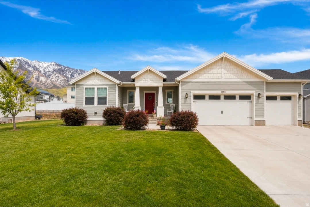 Ranch-style exterior with light gray siding and white trim