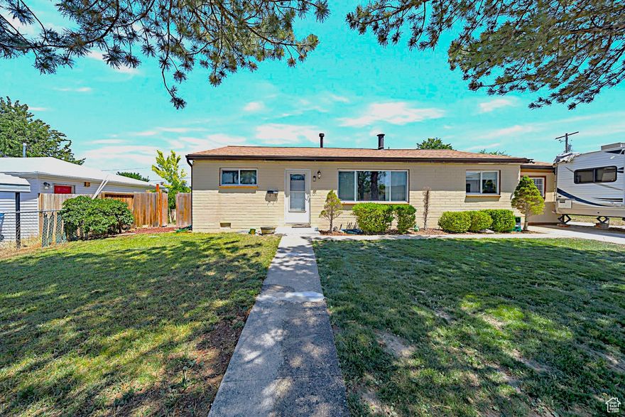 Back on Market - Buyer Financing Fell Through!  Beautifully maintained 3-bedroom, 2-bath home with a HUGE bonus room. Fresh interior/exterior paint, new LVP flooring, new roof, and new water heater. Cozy wood-burning stove and an open, inviting layout.  Enjoy built-in Bluetooth speakers in the kitchen and on the covered patio, which the patio completely encloses for winter for year-round use. The fully fenced yard includes three powered sheds, plus an air-hose assembly running to one shed-just bring your own air compressor.  Low utilities with a solar lease you take over for just $80/month.