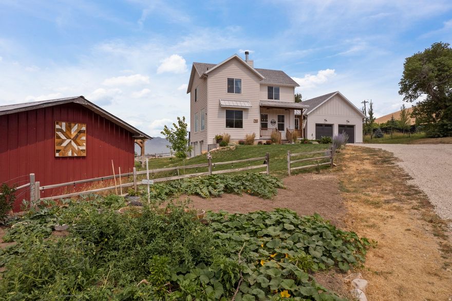 Welcome to this stunning horse property set on just under 7 acres, offering sweeping mountain views and lush green pastures at the base of Daniels Canyon. This serene retreat provides convenient highway access while still giving you the peaceful feeling of your own private rural escape. The property features multiple outbuildings including a large barn, she shed/art studio with solar, tack shed and many animal shelters. There is an EV Charger in the garage, 10 ft vaulted ceilings, reliable and fast Starlink Internet, the ability to board horses, mature shade trees, fruit trees, multiple outbuildings, and a picturesque seasonal stream running right through the property. With 10 valuable water shares, you have all you need to maintain vibrant pastures, a flourishing garden, or expand your agricultural dreams. Whether you envision a hobby farm, a horse boarding facility, or simply extra space to relax and enjoy, the possibilities are endless. Plus, you'll love the quick access to nearby reservoirs, year-round recreation, and some of Utah's most incredible ski resorts. This unique property offers the perfect blend of beauty, convenience, and true country living. Square footage figures are provided as a courtesy estimate only and were obtained from the building plans. Buyer is advised to obtain an independent measurement.