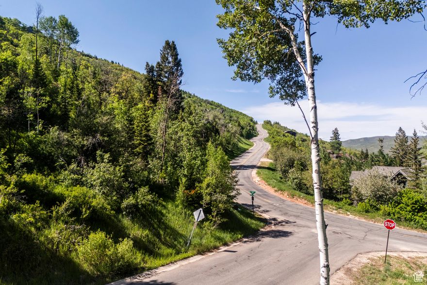 Combining both privacy and serenity with big downhill mountain and valley views from the homesite, this remarkable lot offers a rare opportunity to build a custom home on approx 1.42 acres in Park City. Flanked on two sides by Pinebrook Master Association dedicated open space and accompanying hiking trails, expanding the site into the 21 mile Pinebrook trail system for immediate recreational access. Located in a quiet cul de sac in the coveted Pineridge subdivision of Pinebrook with easy access to Park City and everything the area has to offer - world class ski resorts; Park City Mountain Resort and Deer Valley Resort, Deer Valley Resort is an easy 21 minutes away and is undergoing an historic 3700+ acres expansion, a new village, and revitalizing of the existing facilities. With this expansion, two of the largest ski resorts in North America will be in your backyard. Main Street in Old Town with restaurants, bars, shopping and annual music and art festivals, are a mere 15 minutes away. Additional area/seasonal activities include golf, biking, boating and blue ribbon fly fishing. Within 30 mins of Salt Lake International Airport, the flexibility that this location offers is compelling for any discerning buyer. This lot is offered with a full set of floor plans from the esteemed Otto/Walker architectural firm, known throughout the area for their impeccable design. Pinebrook Homeowners have the use of private tennis courts and sledding hill, plus a community park/ playground/basketball court for themselves and their guests to enjoy. As a year round subdivision, access to all conveniences - grocery stores, shops, restaurants and schools are all located at the base of Pinebrook. Frequent wildlife sightings in an unmatched natural setting completes the scene!