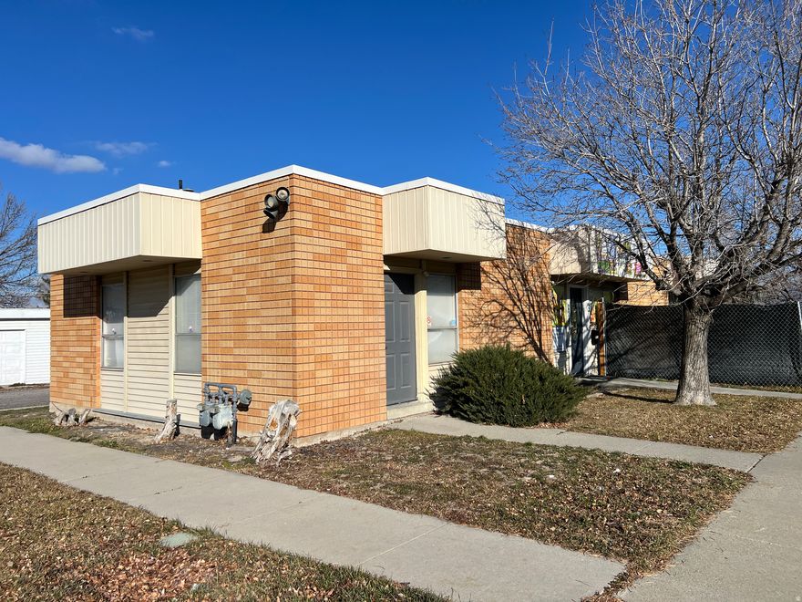 A fantastic investment opportunity! The tenant is a daycare with a lease for the next 3 years. Rent is currently at $3,400 but increasing to $3,600 in 2027 and $3,800 in 2028! That means at the list price the CAP rate will reach 8.5% within 2 years! The tenant is stable, has made significant investments into the property and expects to stay for many years.   The owner only pays property tax with the tenant covering all other expenses, bills, and repairs.  The solid brick building has been remodeled for the daycare business to use both suites. But could be divided again in the future. There is plenty of parking available for the tenant and customers.  Also, there is a 4 car garage on the property that has been converted to individual storage bays.