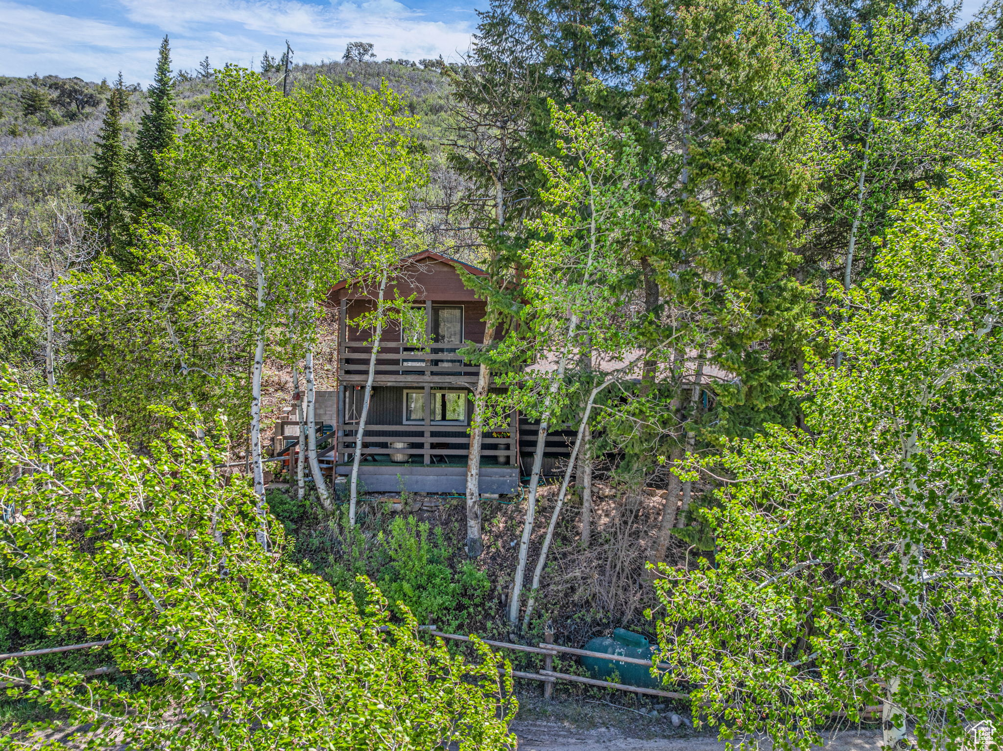 Motivated Sellers! Bring a reasonable offer! Nestled among towering Pine and Aspen trees, this charming mountain cabin offers a perfect blend of rustic charm and comfort. Perfect as a full-time residence or weekend getaway featuring four cozy sleeping areas, it comfortably accommodates families seeking a tranquil nature escape. Warm wood finishes and inviting fireplaces create a cozy atmosphere, ideal for relaxing after a day of outdoor adventures. The shady front porch provides a peaceful spot to enjoy morning coffee or evening sunsets. Located just minutes from scenic hiking and biking trails, and pristine fishing spots, this cabin is a haven for outdoor enthusiasts. Neighboring lot also for sale See MLS# 2085747