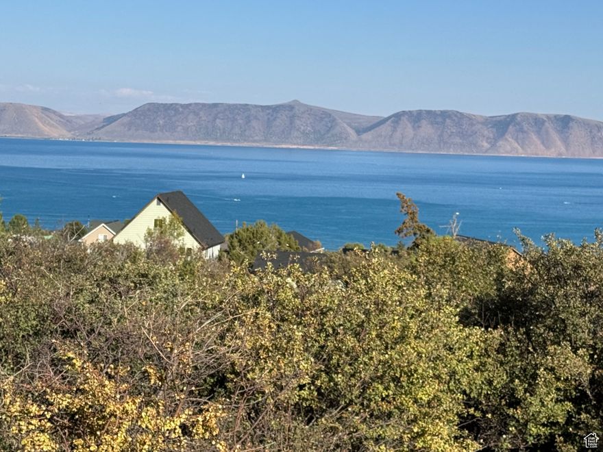 Gorgeous unobstructed Bear Lake VIEW, easy-to-build on lot in beautiful Bear Lake West subdivision.  Close to amenities; pool, hot tub, tennis/pickleball courts, and beach access.  Coopers Restaurant, Lounge, and Bear Lake West Golf Course only minutes.  Bear Lake MARINA & Fish Haven Canyon for ATV & Snowmobile 10 minutes, Beaver Mountain SKI 25 minutes.  Everything you need for summer and winter recreation in this lovely quiet community. No nightly rentals. Lot has been surveyed.