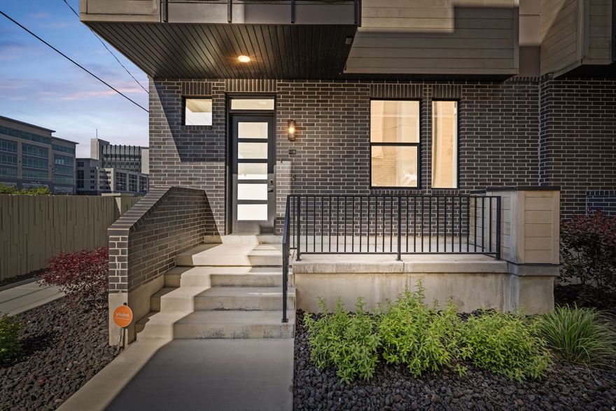*Be Sure to click the "Tour" Link for a 3D Tour* Introducing one of downtown Provo's first contemporary luxury townhome communities-an exclusive 22-unit development redefining modern, walkable city living with rare short-term rental potential. This stunning 3-bedroom, 2,267 sq ft residence combines sophisticated design with premium upgrades throughout, including upgraded quartz countertops, upgraded tile backsplash, upgraded hardwood flooring, upgraded carpet, an upgraded gourmet kitchen, and an upgraded fireplace that anchors the open-concept living space with warmth and style. Expansive windows and 9' ceilings on every level create a bright, airy atmosphere filled with natural light. Designed for elevated comfort and convenience, the home features with an integrated acidifier and humidifier system, alarm system, electric car charger, custom garage storage closet, private balcony, and spacious 2-car garage. The upgraded pergola cover enhances the incredible rooftop living experience, while the expansive 360 rooftop deck-complete with a gas grill and mini fridge-offers breathtaking panoramic views of Mount Timpanogos, Y Mountain, and the iconic Provo City Center Temple. Perfectly positioned in the heart of Provo City Center, this luxury townhome is steps from dining, shopping, entertainment, and nightlife, and minutes from Brigham Young University (BYU), Utah Valley University (UVU), and I-15 access. The HOA covers internet, exterior maintenance, and insurance, creating an ideal low-maintenance, lock-and-leave lifestyle. Rarely available in Provo, the approved short-term rental capability makes this an exceptional opportunity for Airbnb, VRBO, executive housing, or luxury investment income in one of Utah County's most desirable urban locations.