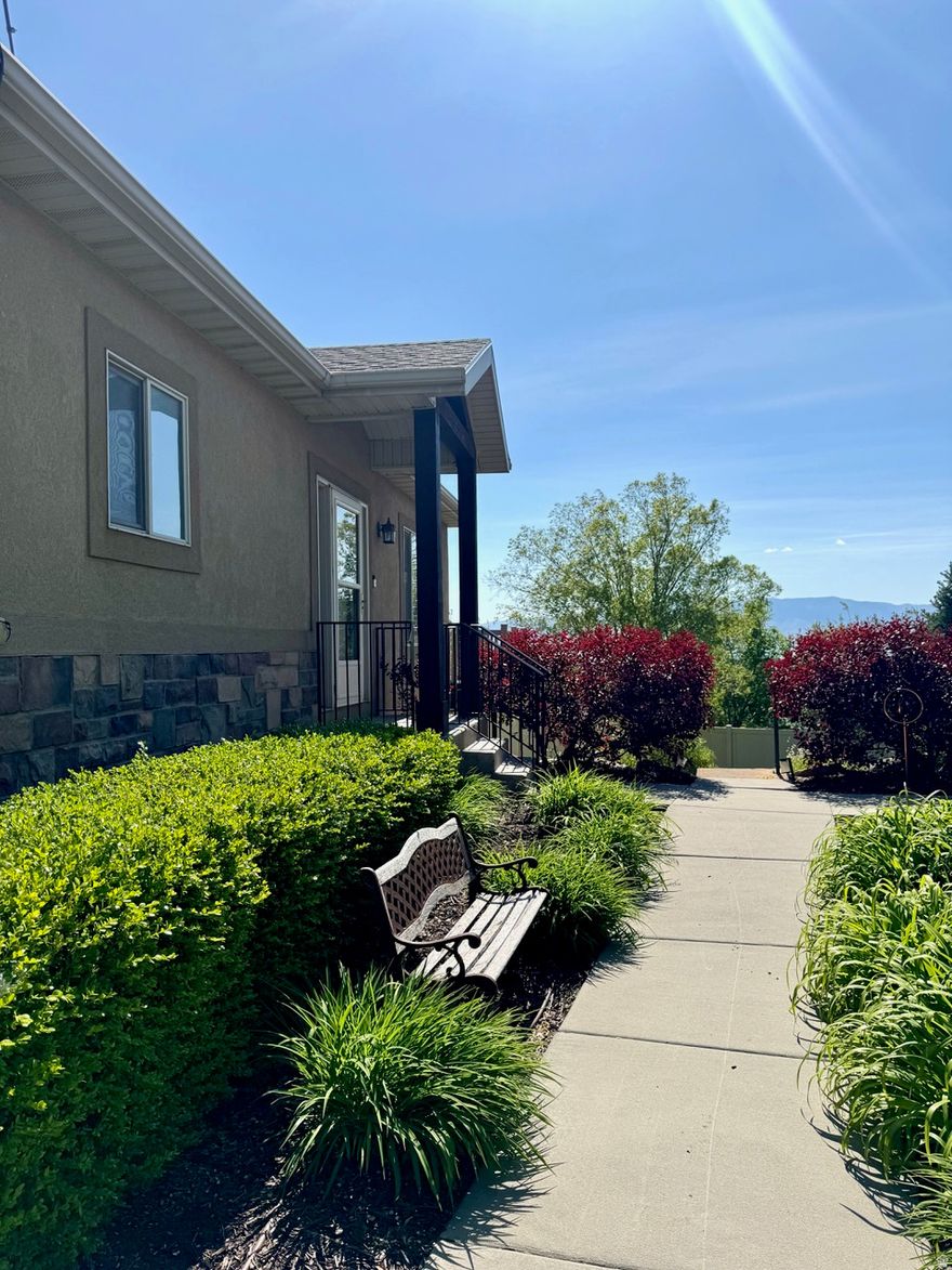 Beautiful, spacious twin home for sale in quiet Orem neighborhood. This home has access for persons with limited mobility. It has a large, electric powered lift in the garage to get someone in a wheelchair or scooter into the home as well as lifts to get down to and up from the basement to the main level. It also has a walk-in jetted tub, extra wide doorways and multiple utility handrails. If you don't need the ADA items, no worries, these things are easily removed. On the main floor the home boasts 10 foot and vaulted ceilings, 3 bedrooms, 2 full baths, open concept family/dining/kitchen, gas fireplace, and a massive walk-in closet in the primary ensuite. The basement is a spacious mother-in-law apartment or just more room for you. The basement consists of two bedrooms, a full bath, an amazing two-story playhouse, high ceilings, an open concept family room/kitchen area, a separate dining room and a large office or workout space. French doors walk out to a patio and grass area, with a playground just a few yards away. Other features of this large 5-bedroom home are its attached 2 car garage, tons of storage with a dedicated storage room and cold storage room, granite countertops, solar panels (paid off), views of Utah Lake, gorgeous sunsets. The home is located in the Peach Haven subdivision in Orem with quick access (2 min) to I-15 and Center Street. The community has an HOA that maintains the grass, sprinklers, snow removal and playground areas. The monthly HOA fee is $140, there is no transfer fee associated with the HOA.