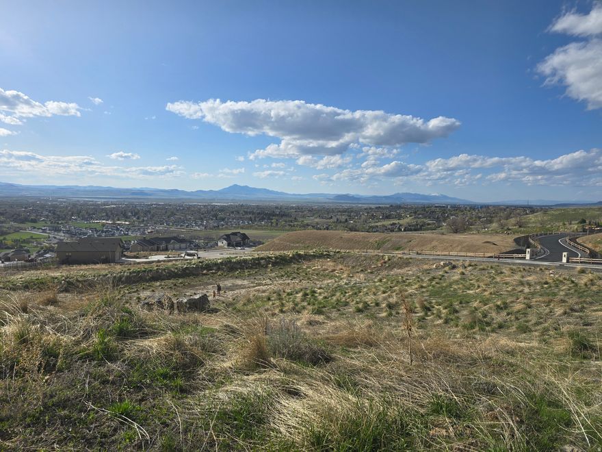 Take advantage of this rare opportunity to own a scenic residential lot at 840 E Spring Creek Crossing in Providence. Fully developed and stubbed, ready to build on. Located in a developing highly sought after area. This property boasts some of the best mountain and valley views in Cache Valley. The elevated setting is ideal for a custom home designed to capture breathtaking sunsets, and wide-open skies, all while remaining conveniently close to Logan, shopping, dining, and outdoor recreation.  Acreage figures are provided as a courtesy estimate only and were obtained from parcel records.  Buyer is advised to obtain an independent measurement. Agent is the owner of the property.
