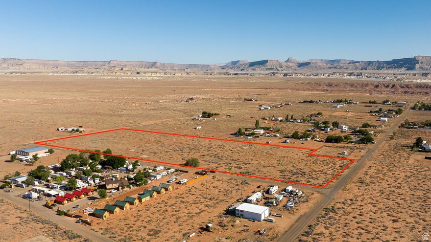 Endless possibilities await on this 14.08-acre commercially zoned parcel - a blank canvas for your next investment venture. Perfectly positioned between Utah and Arizona, with stunning Lake Powell just minutes away, this property offers both opportunity and location. With two water connections already in place and paved roads on both sides, accessibility is effortless. The C1 zoning allowable uses include: Multi-Residential, Residential and Agricultural. Seller financing may also be available, making this a rare chance to start your next big project with flexibility and ease. Your next adventure begins here! Survey has been completed and available. (Buyer to verify all)