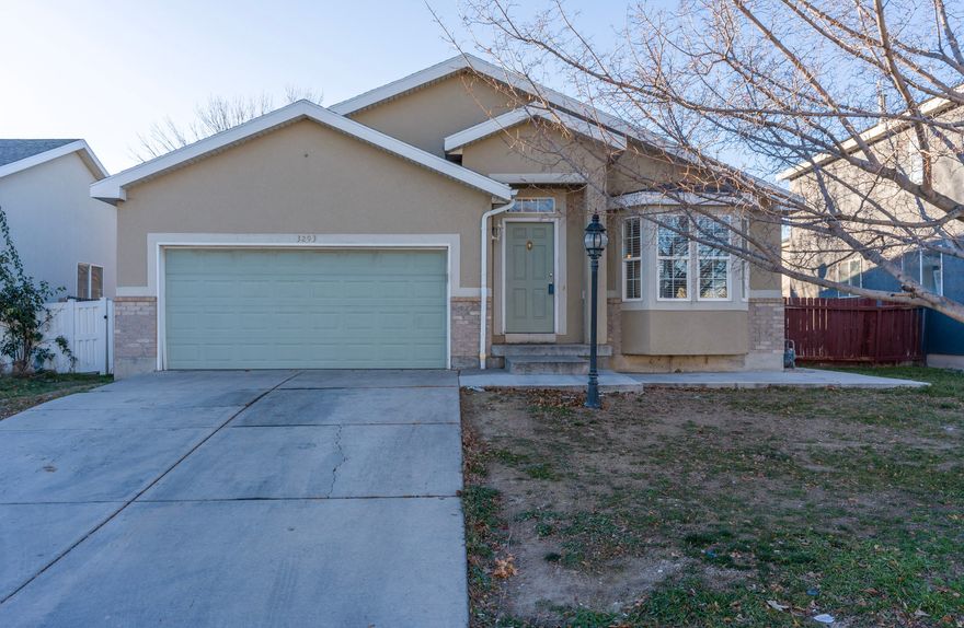 This charming, move-in-ready home features four bedrooms and three bathrooms, a fully fenced yard, and a two-car garage. Conveniently located just minutes from I-215, Bangerter Highway, and a shopping center, as well as Salt Lake International Airport, this property offers both comfort and easy access. The basement has been recently upgraded to include an additional bedroom, a bathroom, and a spacious family room.