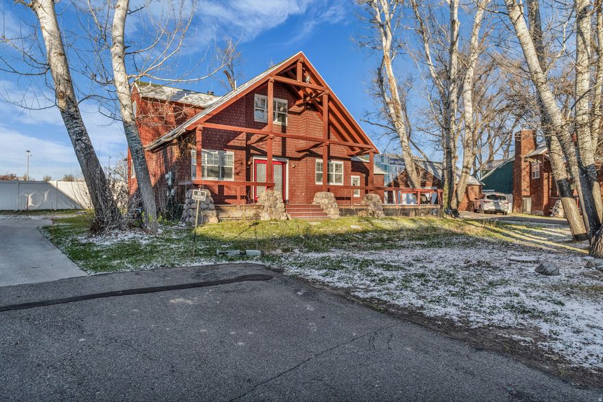 A bit of serenity in the City. 2-story home tucked at the end of the street in the trees. Located in a quiet PUD with no through traffic. Vaulted open-concept main floor offers kitchen, living room with fireplace, two bedrooms, one full bath, and radiant heat wood style flooring. Loft-style vaulted ceiling primary suite provides a private retreat with en-suite bath, soaking tub, and walk-in closet. Finished basement includes an additional two bedrooms and full bath. Laundry. Easy nearby access to I-215 for close to commute to all areas of the valley. Buyer to verify all information. HOME IS SOLD AS-IS.