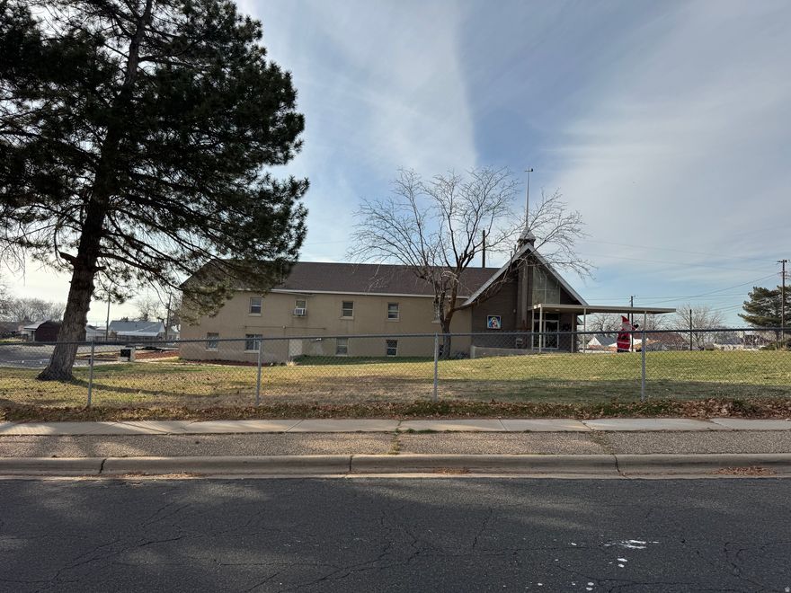 Rare opportunity! 2.25 acres with 7,868 square foot church and school building. Zoned R-1-6, meaning Residential, Single Family, minimum of 6,000 square foot lot size. So this property could hold up to 11 single family residential building lots with city approval. Parcel numbers 120180005, 120180006, 120180007, and 120040172 included in listing.