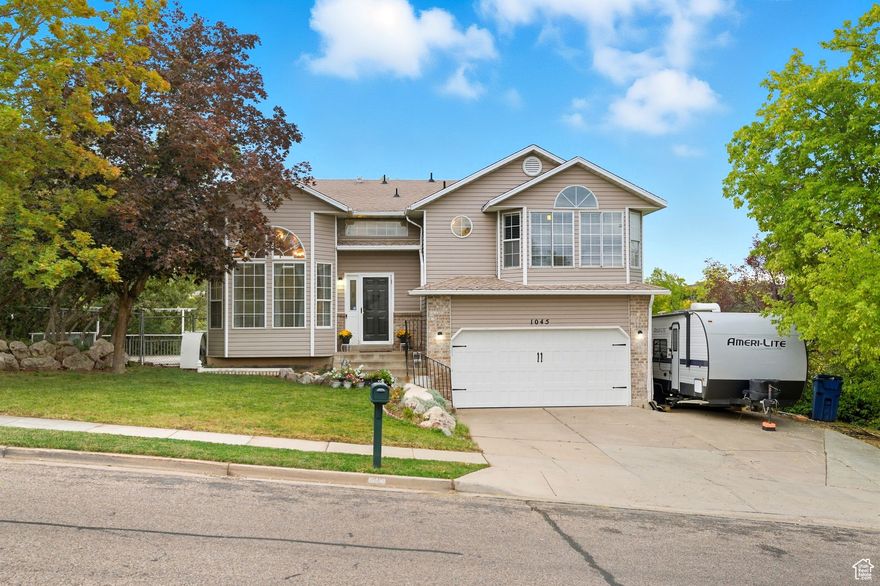 Discover your perfect home at 1045 E 5100 S in vibrant South Ogden! This 7-bedroom, 4-bathroom residence offers incredible space and flexibility for families, entertainers, or anyone craving comfort. With a fully finished basement, there's room for a game room, office, or guest suite or all of the above.  Host unforgettable gatherings on two large decks, ideal for barbecues, parties, or relaxing under the Utah sky. Just steps from Glassman Park, enjoy easy access to green spaces and outdoor fun. Nestled in a welcoming neighborhood, this versatile home is ready for your next chapter-schedule a tour today!