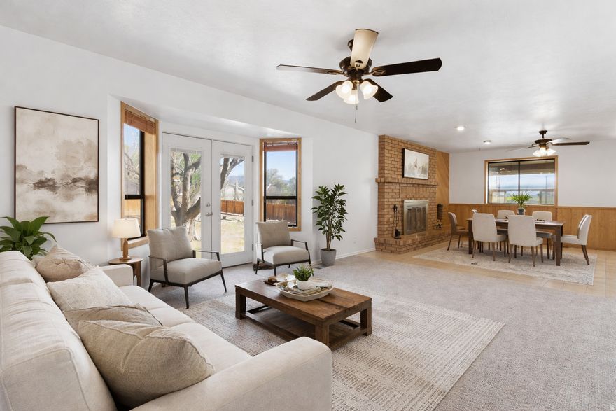 SOLAR!!! Looking for an inexpensive utility bill every month? The homes solar is owned not leased!!  This 6-bedroom, 2.5-bath home offers 3,648 sq. ft. of living space on just over half an acre in a great location. Many of the big updates have already been done, including owned solar panels installed in 2019, a new HVAC system in 2022, a new roof in 2024, and a tankless water heater with water softener installed in 2023. The upstairs bedrooms and bathroom have new windows, and all basement windows were replaced in 2016. The whole house has fresh paint and new carpet throughout, giving it a clean, updated feel with plenty of space to spread out. There's also a separate basement entrance, which could work well for an Airbnb or even two separate living spaces if you decided to add a kitchen downstairs. One of the standout features is the sunroom with a hot tub-perfect for relaxing or even growing plants year-round with all the natural light. Outside you'll find garden boxes, mature trees, space for animals, fully fenced yard, along with easy access to a scenic walking path. This home has a lot going for it and is priced to sell. Square footage provided as a courtesy from county records; buyers are encouraged to verify.