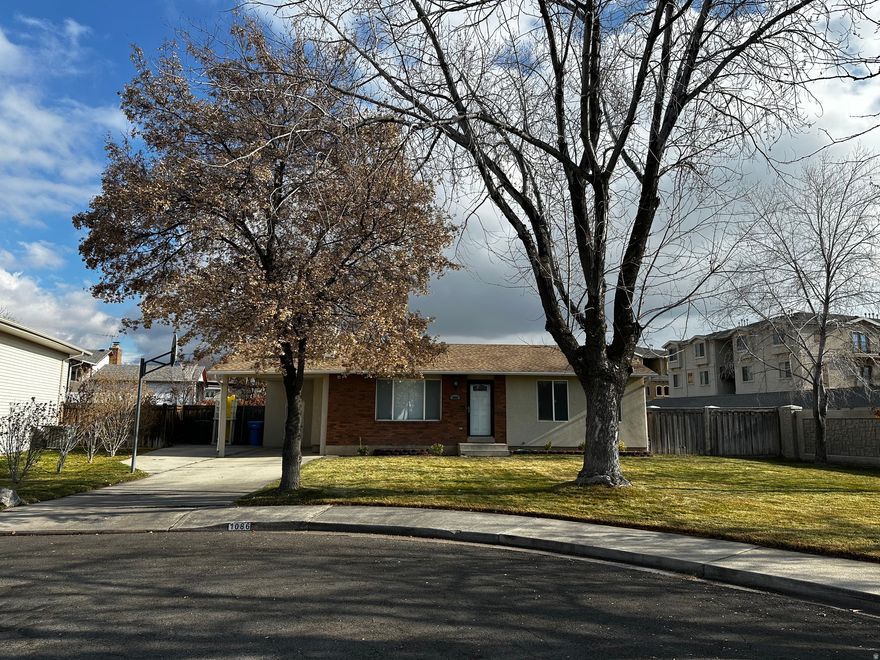 Welcome home to this beautifully maintained and thoughtfully updated 4-bedroom, 2-bath home located in Orem's desirable Bonneville neighborhood. Enjoy peaceful cul-de-sac living while being just 23 minutes from I-15 and within a few miles of Utah Valley University (UVU) and Brigham Young University (BYU)-- the perfect blend of quiet comfort and unbeatable convenience.  Inside, you'll find continuous luxury vinyl plank flooring throughout the main level and a bright, inviting layout. The kitchen features a built-in dining table that seats seven, with unique suspended seating that never touches the floor-- both practical and eye-catching.  This home has been meticulously updated for comfort and peace of mind: New furnace and A/C (May 2024); New roof (December 2024); New stucco siding and eaves (September 2021).  Step outside to a fenced backyard designed for relaxation and productivity. You'll find three mature strawberry beds, a raspberry patch, and a fruit-bearing nectarine tree, plus a cozy patio area and storage shed. Large, mature trees provide beautiful shade and privacy throughout the summer.  Don't miss your chance to own a beautiful piece of the Bonneville neighborhood!