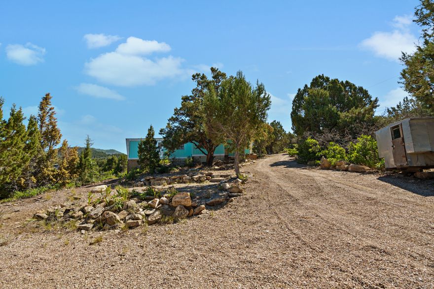 Year-round access lot in Skyline Mountain Resort with stunning views of Fairview Valley! This lot is ready for your dream cabin or home-or enjoy it as-is with the vintage trailer already on site. Just far enough to feel like a true getaway, yet close enough for easy access when needed. Enjoy all the community amenities including a pool, clubhouse, rental cabins, RV park, golf course, and endless outdoor recreation. A perfect mountain escape!