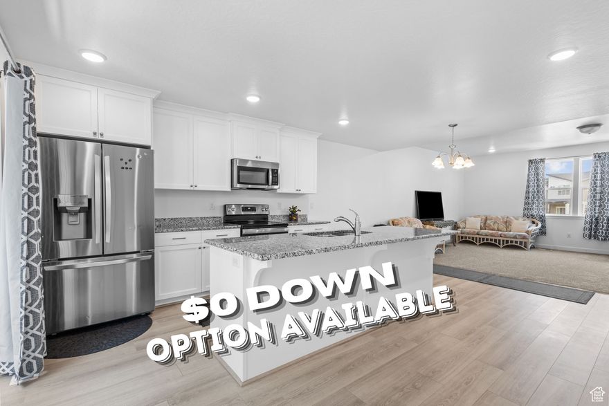 Ask about $0 Down financing **This home was featured on "Utah's Real Estate Essentials" on ABC4, HULU+Live TV & Telemundo Utah** For video, search the address on YouTube. Nearly new townhome built in 2023. This modern residence offers a perfect blend of comfort and style with 4 spacious bedrooms and a very  open-concept main floor. Soaring 9-foot ceilings and massive windows flood the space with natural light. The kitchen features beautiful 42-inch cabinets with crown molding, granite countertops, stainless steel appliances and a large pantry along with a 10-foot sliding glass door leading to your very own balcony, making this home ideal for everyday living and entertaining. Enjoy a round on the pickleball/basketball court or a picnic in the park just a few steps from your front door. Commuting is a breeze with easy access to Bangerter Highway and Mountain View corridor. Shopping and entertainment are just 5 minutes away at Mountain View Village and the Herriman Rec Center. A variety of dining & retail options, parks, schools, the Riverton Costco, medical facilities, a local theatre and  the Daybreak TRAX station is less than a 10-minute drive. Don't miss this opportunity to make it yours!  Square footage figures are provided as a courtesy estimate only and were obtained from County records.  Buyer is advised to obtain an independent measurement.