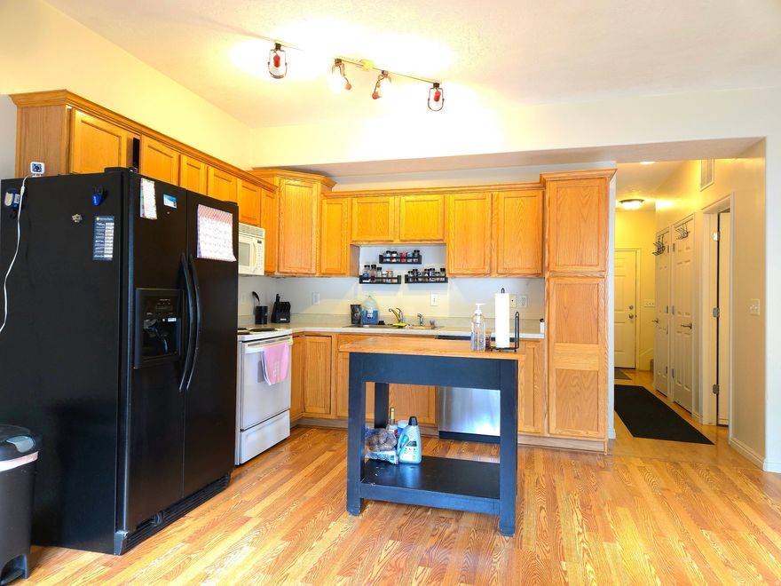 Charming 3  bedroom, 2.5 bath home in a prime West Jordan location, just minutes from Jordan Landing with convenient access to 1-15 and beautiful mountain views. The updated kitchen includes  refrigerator, range and newer dishwasher.  New flooring in the kitchen and family area. Enjoy an enclosed patio, perfect for pets. Community amenities include a basketball court and pool. This home is priced to sell.