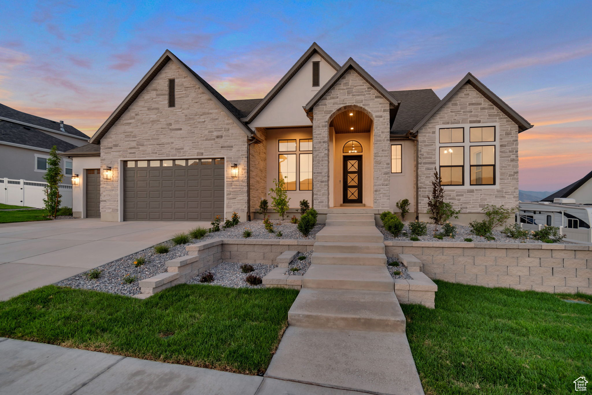 LOT#203. Come see the difference from Symphony Homes, a renowned local builder of semi custom homes! Great looking rambler, the Tempo plan with our beautiful European Romantic exterior, offers an ideal floor plan and magnificent views of the Wasatch from the west bench of the valley! Many upgrades throughout and classy interior design and finishes! Decorative wall in flex room off of entry, engineered hardwood floors and stunning grid bean ceiling in the family room. Galley kitchen with oversized island bar, butler's pantry, and dining nook. Owner's suite has a recessed ceiling, garden tub, oversized shower with Euro glass and the walk-in closet is finished with custom built-ins. 2nd bedroom on main level has its own ensuite bathroom! Dedicated laundry room with a countertop. You'll love entertaining in the finished basement with family room/game room and attractive wet bar. One basement bedroom also features an ensuite bathroom, and there is a finished storage closet. 14x14 covered patio, and lots of storage space throughout. 3rd stall of garage is 42' deep! Equipped with active radon system. Community swimming pool. Full yard landscaping is included in price and is currently in progress. Don't miss this one!