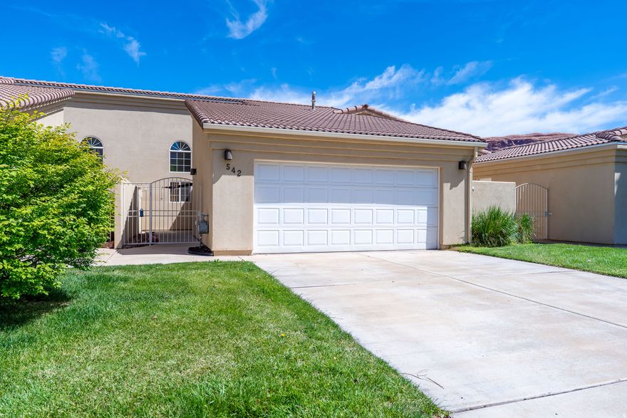 This 2 bed 2 bath townhome in Orchard Villa has been thoughtfully updated throughout with newer cabinetry, Corian countertops, quality appliances, bar-top seating, and luxury vinyl tile flooring. The primary suite has a dual vanity with a separate tub/shower and toilet, and a large walk-in closet. The second bedroom sits just off the second full bathroom/laundry room combo. Enjoy outdoor living in the private front courtyard with an added shade canopy, or out the sliding glass back doors that lead to your private patio and shared lawn. There is plenty of parking and storage in the two-car garage with attic space, plus an extended driveway. Community amentities include a pool and extra parking for your campers, side by sides, or extra vehicles. Orchard Villa is conveniently located walking distance from the hospital, a convenience store, a local coffee drive through, the BMX park, and biking/walking trails. Nightly renting is not permitted. This property is in a community reinvestment area and qualifies for a community reinvestment act mortgage loan (CRA). As little as 3% down. To prequalify for special financing, contact listing agent.