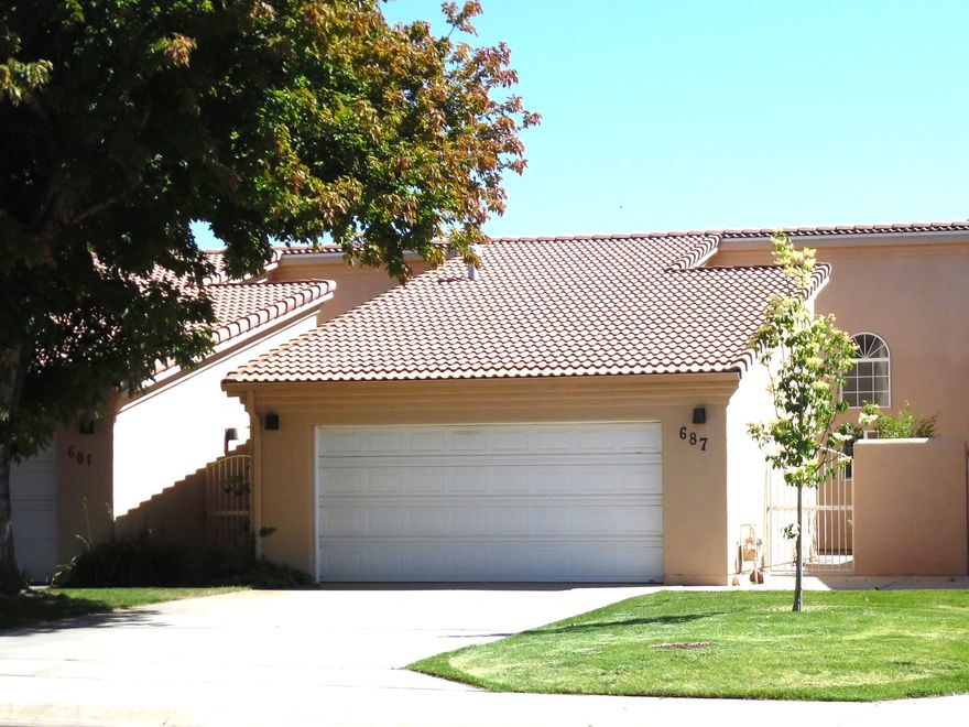 Lovely quiet townhome centrally located near churches/City Park/ indoor/outdoor pool and playground. Lovely courtyard entering the front door. This has an open floor plan with a large open kitchen. New brushed appliances 5 years ago. Great counter space! All wood cabinetry and storage galore. Large combination dining and living room with corner gas log fireplace. Roomy master bedroom with large en-suite, large walk-in closet, vanity with double sinks. Both bedrooms and living room have new ceiling fans. Vaulted ceilings in kitchen, living room and master bedroom. This townhome offers a large 2-car garage with plenty of room for shelving. Covered back patio off living room. All of this and more $465,000. Very friendly neighborhood.