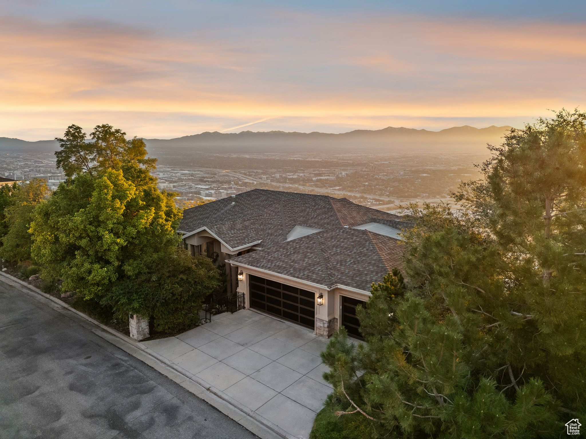 Stunning, fully remodeled luxury home perched above the city with breathtaking panoramic views of the Salt Lake Valley. Located in one of Salt Lake City's most desirable neighborhoods, this home seamlessly blends sophisticated design with top-tier upgrades. Inside, you'll find a chef's kitchen equipped with premium Wolf and Sub-Zero appliances, complemented by all-new paint, flooring, and lighting. Comfort is a priority with three brand-new furnaces and AC units ensuring year-round climate control. Step outside to experience four private decks, perfect for relaxing or entertaining while soaking in the unbeatable views. The beautifully landscaped yard also features a custom putting green, bringing resort-style living right to your doorstep. From its elevated setting to its impeccable finishes, this home offers the best in luxury, lifestyle, and location. Truly move-in ready and designed to impress.