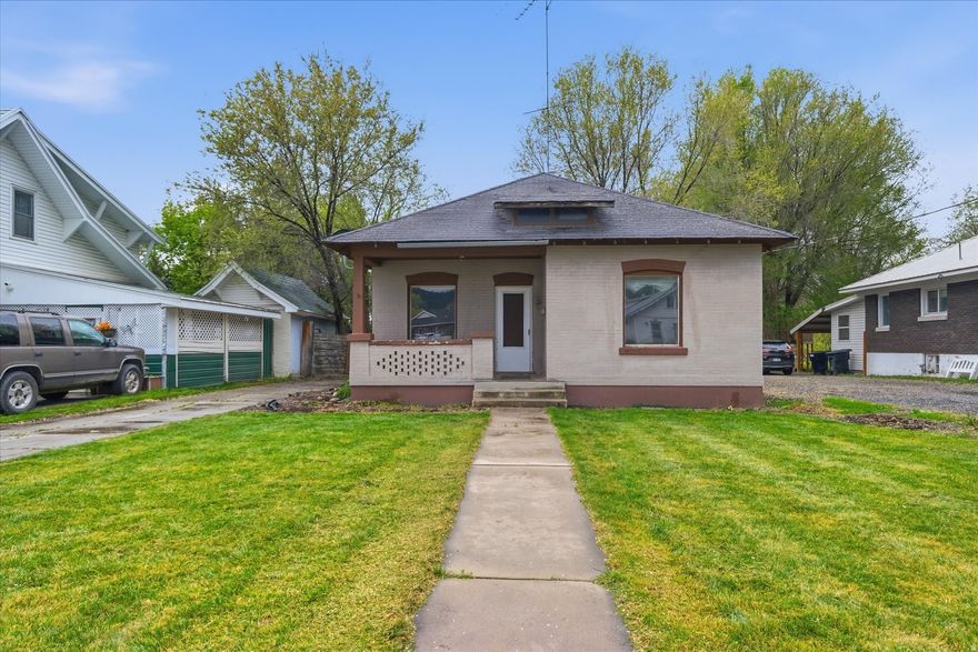 Charming brick cottage-style bungalow featuring a welcoming front porch and large front windows that fill the main living space with natural light. This home offers convenient single-level living with 2 bedrooms and 1 bathroom, along with a yard that includes mature trees and a private backyard setting. This property requires significant updates and is ideal for buyers looking to renovate and build equity. Being sold as-is-seller will not provide seller disclosures. The home will not qualify for FHA or VA financing; conventional or cash offers only. Seller will not make any repairs or offer concessions. Buyer to verify all information. Be sure to check out the video tour link!