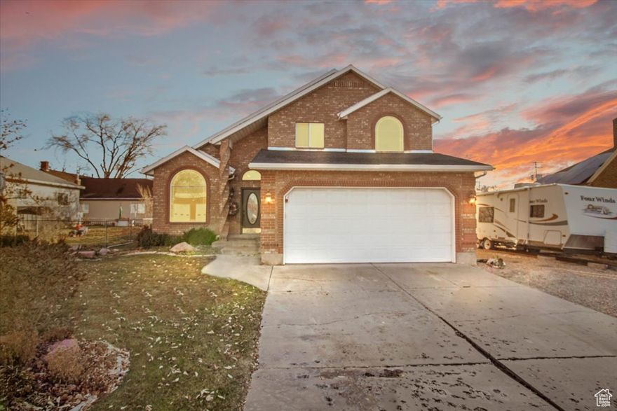 Welcome to this spacious 2,442 sq ft all-brick home, offering a perfect blend of comfort, functionality, and outdoor appeal. Situated on a beautifully landscaped .28-acre lot, this property features 4 bedrooms, 2 full bathrooms, and a finished basement with plenty of potential. The main level of the home boasts a welcoming open layout with large windows that fill the space with natural light. The kitchen and dining areas are perfect for family gatherings, while the living room provides a cozy retreat for everyday relaxation. The finished basement includes a bedroom and expands your living space even further, offering room for a home theater, game room, or extra family space. A partially finished bathroom is already set up with all the materials you need to complete it. The beautifully landscaped yard is fully fenced, providing privacy and a great place for outdoor activities. You'll appreciate the added convenience of a storage shed for tools and outdoor gear, along with a large shop perfect for hobbies, projects, or additional garage. For those with an RV, there is dedicated parking with an electrical hookup, allowing you to easily plug in and store your vehicle when not in use.