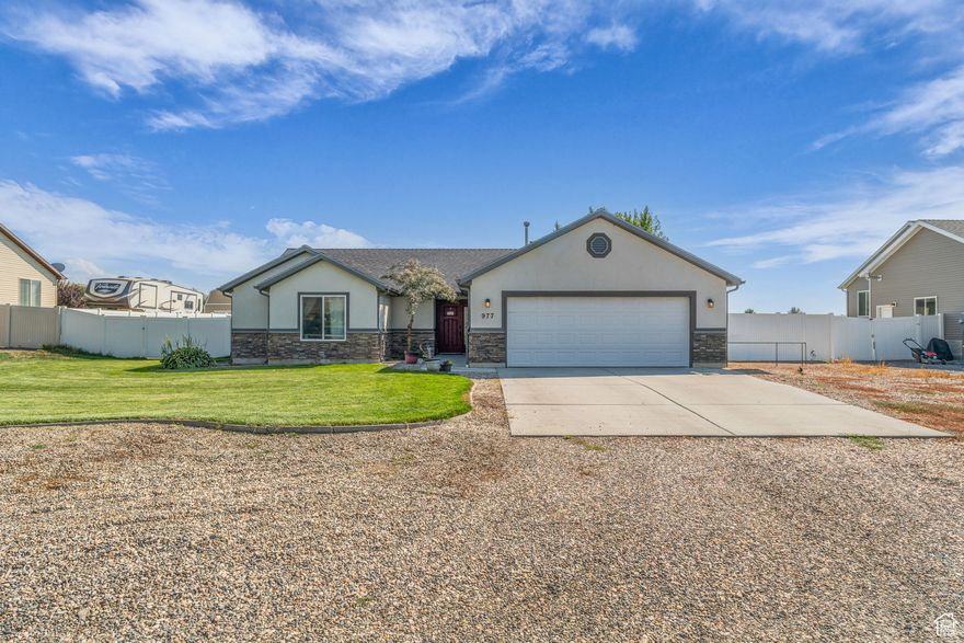 Are you looking for land?  This one level home is sits on just under half  acre! Vaulted ceilings fill the living spaces with light and openness. Every bedroom features its own walk-in closet, giving everyone plenty of room to stay organized. The oversized garage offers space not only for vehicles but also for storage, hobbies, or a workshop. Out back, a large covered patio creates the perfect spot to unwind, entertain, or simply enjoy the outdoors in comfort year-round. Plus, with PAID OFF solar panels, you can enjoy energy savings from day one.