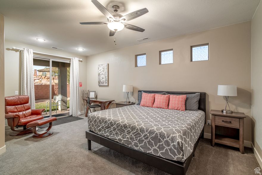 Your fully-furnished Southern Utah escape awaits! This spacious single-level home in Ladera at Sienna Hills is completely move-in ready with no-step entry throughout. Built in 2019, this modern rambler offers 2,161 square feet of comfortable living space perfect for family getaways and multi-generational stays. The open great room flows from kitchen to living to dining areas. Step outside to two covered patios - one with gas BBQ, the other featuring your private 7-person hot tub and grassy play area. The community pool sits conveniently at the neighborhood entrance. Inside find a game room with Xbox, multiple Roku TVs, smart home features, granite counters, and vaulted ceilings. Location delivers: 10 minutes to St. George, 45 minutes to Zion, 20 minutes to Sand Hollow and Quail Creek, adjacent to Sienna Hills Park. Short-term rental approved to help offset costs when you're not using it. HOA handles all landscaping for $195/month. Sold completely furnished - your first stay happens the week you close!