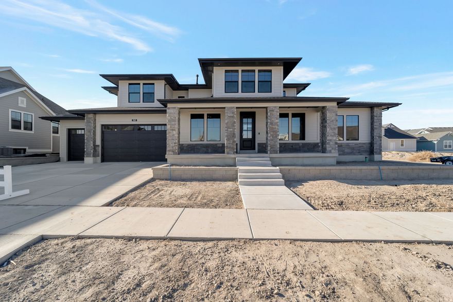 Lot#141 in Beacon Pointe by Symphony Homes. This stunning Browning XL plan blends luxury with thoughtful design. It was designed to be a model home, so it's stacked with lots of upgrades and designer finishes throughout, and it shows! The main floor features both a flex room (w/ French doors) and a formal living room, each with custom millwork, plus a grand great room with two-story beamed ceiling. The gourmet kitchen has ZLine appliances including a 48" dual-fuel range and built-in refrigerator and freezer, a spacious butler pantry, and a bright dining nook that opens to the covered patio. A custom mudroom bench and a large laundry room add everyday convenience. The expansive primary suite includes a custom closet with washer&dryer hookups and gorgeous bathroom. Upstairs has a loft open to below. All bedrooms feature walk-in closets. The fully finished basement is built for entertaining with a media room, kitchenette, huge game room, and a gym with 3/4 bathroom. Finished garage with epoxy floor, 9' foundation walls, an active radon system, and a cold cellar. A must-see!