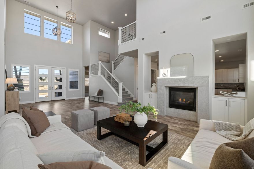 This beautiful 4,617 sq. ft. home in East Creek Ranch sits on a -acre lot with a large fenced yard and stunning mountain views to the south. Bright, open, and filled with natural light, it features a gourmet kitchen with a large island, walk-in pantry, and a two-sided fireplace connecting the kitchen and great room. The main-level primary suite includes a private office and backyard access. Additionally, on the main level, there is a guest bedroom with access to a full bathroom. On the second level, there are three additional bedrooms and an extremely large bonus room. Two laundry rooms, covered patios, and easy freeway access make this home a perfect blend of space, comfort, and modern mountain living-all within the Park City School District.