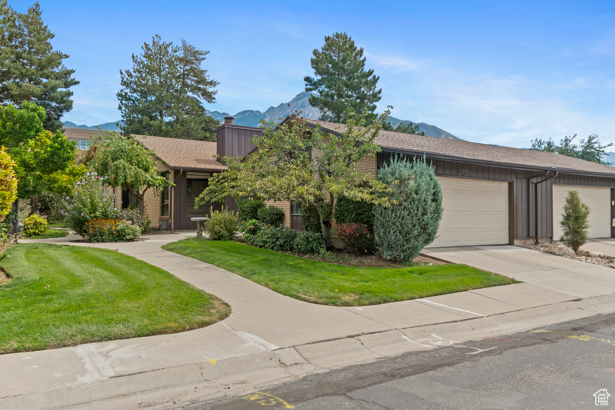 This single level access luxury condo offers everything you need for living an ideal life, at any stage, in the coveted central Holladay area. A full gut job in 2018 has delivered a dream renovation featuring real hickory hardwood floors throughout the main level, tankless water heater, water softener, large double pane windows with blinds, open concept living areas, spacious primary bedroom with en suite, cozy office, and covered access from home to garage. Electrical, plumbing, and HVAC were all big ticket items replaced/updated during renovation. The roof was replaced in 2024 along with community road repairs. Come take a look at your next home!