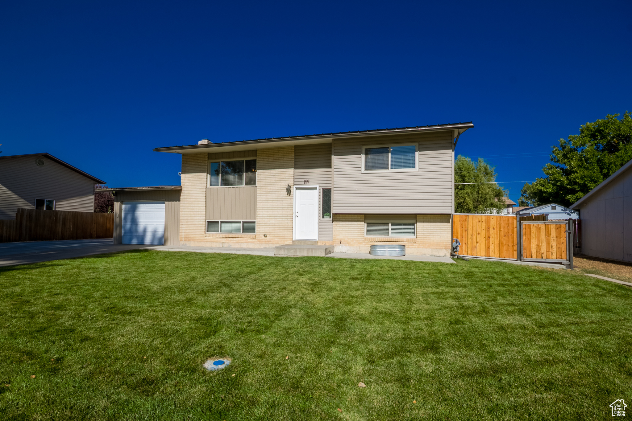 Discover this immaculate bi-level home in a prime Vernal location. Offering 3 bedrooms, 3 bathrooms, and 1,784 sq. ft., this beautifully updated home is move-in ready. Inside, you'll find modern updates throughout, while outside showcases a fully redone, professionally landscaped yard-perfect for relaxing or entertaining. With its great location and exceptional condition, this home is ready to welcome its next owner! Square footage figures are provided as a courtesy estimate only. Buyer is advised to obtain an independent measurement.