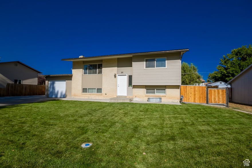 Discover this immaculate bi-level home in a prime Vernal location. Offering 3 bedrooms, 3 bathrooms, and 1,784 sq. ft., this beautifully updated home is move-in ready. Inside, you'll find modern updates throughout, while outside showcases a fully redone, professionally landscaped yard-perfect for relaxing or entertaining. With its great location and exceptional condition, this home is ready to welcome its next owner! Square footage figures are provided as a courtesy estimate only. Buyer is advised to obtain an independent measurement.