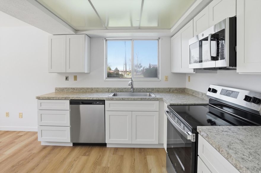 Freshly updated! This desirable end-unit features a brand new kitchen with new cabinets, countertops, and appliances (range, microwave, and dishwasher), along with new hard-surface flooring and fresh paint throughout the main level, creating a clean, modern feel. The 3-bedroom layout includes a spacious primary suite with three closets, offering rare and practical storage. Enjoy both front and back patios, a 2-car covered carport with additional storage, and the ease of low-maintenance living. The Emerald Hills community offers fantastic amenities including a pool, pickleball courts, beautifully maintained grounds, picnic areas, and optional RV storage (for an additional fee). Rentals are not permitted.
