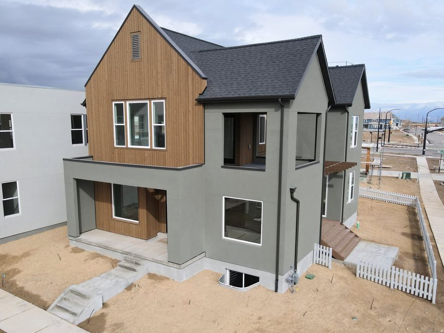 Brand New Home with the striking new cedar wood exterior option! Enjoy stunning views from the many outdoor areas in this popular Adventurer floor plan! Price includes impressive designer upgrades such as: 9-foot ceilings on all levels, A cozy fireplace, modern railing, coveted indoor/outdoor living layout with oversized sliding glass doors connecting the Great Room and Kitchen with outdoor patio space. The main-level office is filled with natural light thanks to abundant windows perfect for work or relaxation. Upstairs, the dreamy Primary Suite features its own covered, hot tub-ready balcony, along with a luxurious en-suite bathroom complete with a stand-alone soaking tub and a spacious walk-in shower. Full landscaping and a fenced side/backyard. Estimated completion: Feb-March 2026. *Ask about our preferred lender incentive!