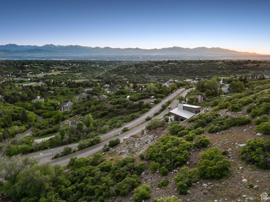 Life Elevated!  Discover the perfect canvas for your dream mountain retreat with this pristine 2.32-acre upsloping lot, offering sweeping 270 views of the valley. Situated just south of Little Cottonwood Canyon, this property places you minutes from world-class skiing, hiking, and biking-an outdoor enthusiast's paradise.  A completed set of approved building plans is included, saving you valuable time and allowing you to start construction right away. With its natural elevation, breathtaking vistas, and unbeatable location, this lot provides both privacy and convenience in one of Utah's most sought-after areas.  Build your vision. Live the lifestyle. Life Elevated awaits!