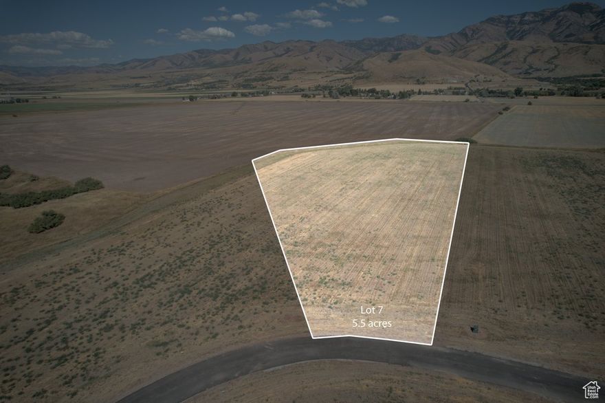 A versatile 5.5 acre lot with agricultural ground, privacy, and mountain views. Whether you are looking for a country estate or hobby farm, this property is a great fit. Convenient access and just 15 minutes from Cherry Peak Ski Resort.