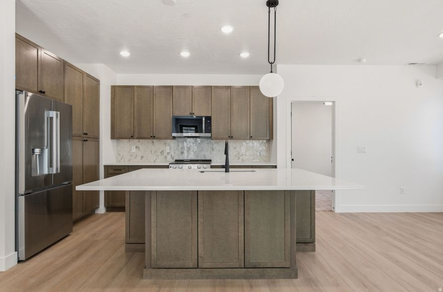 Designed for adventure and relaxation, this spacious 5-bedroom, 5-bathroom condo in Terra's Loft building offers the perfect home base for your Southern Utah escape. Spread across three stories, this thoughtfully crafted home features open living spaces, modern finishes, and a private rooftop deck with a hot tub-ideal for unwinding after a day of exploring. Enjoy access to resort-style amenities, including a pool, waterslide, lazy river, and pickleball courts, or venture out to Zion National Park, Sand Hollow, and Quail Creek. Whether you're making memories with family or friends, this condo is built for fun and convenience.