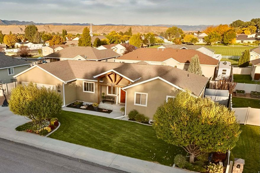 Located in one of Price's most sought-after and established neighborhoods, 108 North Balsam Drive offers an exceptional blend of space, style, and thoughtful upgrades across 3,024 square feet of beautifully maintained living space.  This impressive home features 5 spacious bedrooms and 3 full bathrooms, providing flexibility for family, guests, and entertaining. The heart of the home is warm and inviting, with generous living areas, quality finishes, and an effortless flow designed for both everyday living and hosting.  The newly remodeled basement is a true standout-featuring a large family room, perfect for movie nights or gatherings, and a wet bar that elevates the space into a premier entertainment area. Whether hosting friends or enjoying a quiet evening, this lower level adds both luxury and functionality.  Upstairs and down, you'll appreciate the abundance of storage, including a large garage and extensive RV parking, making this property ideal for those with recreational vehicles, trailers, or multiple toys-an increasingly rare find in town.  Outside, the home sits in the heart of Westwood, known for its pride of ownership, peaceful streets, and upscale feel. This is a neighborhood where homes are cared for and value is protected.  With its combination of space, recent updates, RV parking, and premier location, this property stands out as one of the most complete offerings currently available in Price.   Square footage figures are provided as a courtesy estimate only and were obtained from County Records .  Buyer is advised to obtain an independent measurement.