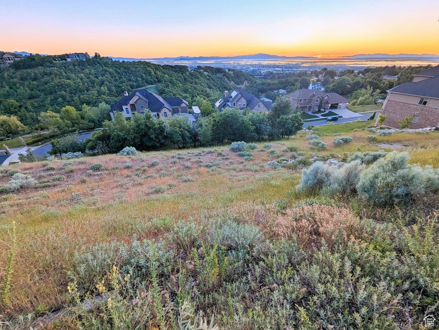 A golden opportunity to build your dream home on the last available lot in Temple Ridge, one of the most prestigious east-bench custom home estate communities in Bountiful. This exclusive lot offers unparalleled elegance and breathtaking views of the Great Salt Lake, Antelope Island, Stansbury Island, Fremont Island, and Promontory Point. Enjoy the grandeur of the Great Salt Lake with spectacular 180-degree views of the Salt Lake Marina and Farmington Bay in the foreground, featuring the sparkling waters of Stansbury Bay in the backdrop.  Experience the unbelievable daily transformation of the island contours from majestic purple at dawn to breathtaking azure at sunset. Enjoy the seasonal transformation from spring alpine to fall foliage of the lush valley and south-facing hills nestled against the picturesque island/lake views with the best views of July fireworks.  Walking distance to the popular hiking trails in Mueller Park, leading up to the iconic Elephant Rock. Dream big with a luxurious sports court, infinity pool, and ample space for all your heart's desires. With island/lake views from every angle, this lot is an extraordinary opportunity to create your architectural masterpiece. This estate lot has access from both Temple Court and Millbrook Way. This lot may also be purchased with the nearly 10,000 sq ft estate home next door for a total of $3.5M. Buyer/Broker to verify all.
