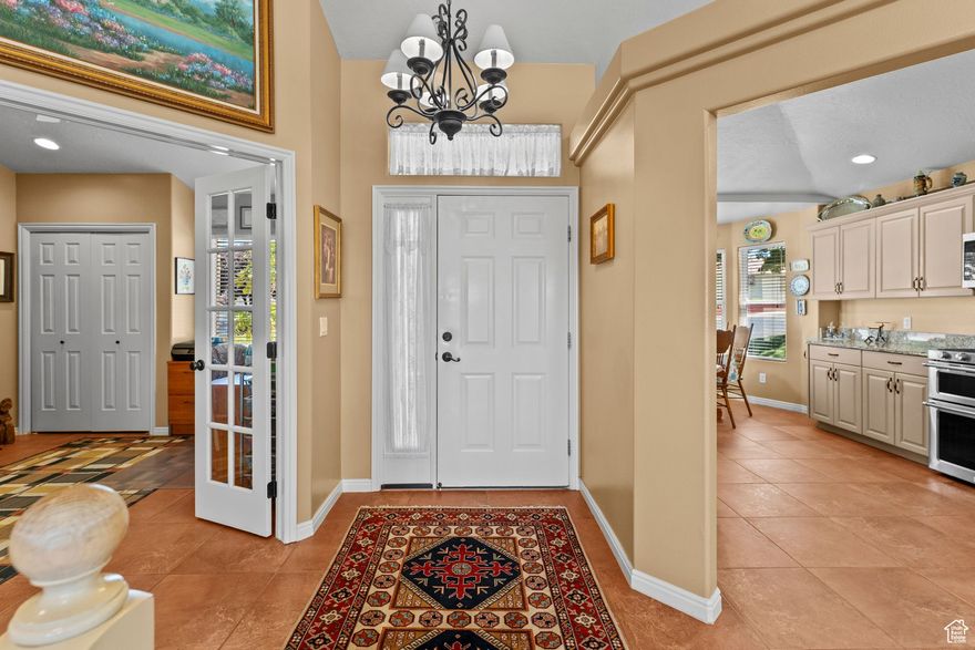 This spacious and well-maintained 6 bedroom, 3 bathroom home is a must-see! Located in the highly desirable Tamarack PUD, residents enjoy access to fantastic amenities including tennis courts and a community pool.  The main level boasts an open-concept floor plan with stunning imported Italian tile throughout the main living areas. The kitchen is fully updated with granite countertops, newer appliances, and plenty of space for entertaining. Downstairs features a large family room, a huge storage room, and additional bedrooms-perfect for guests or a growing household.  The home has been thoughtfully upgraded with modern finishes and offers low-maintenance grounds, giving you more time to enjoy the community and surrounding area.  Don't miss the chance to make this beautiful home yours-schedule a showing today!